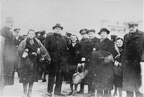 Adam Czerniakow, head of the Warsaw ghetto Jewish council, poses with a girl that he succeeded in freeing